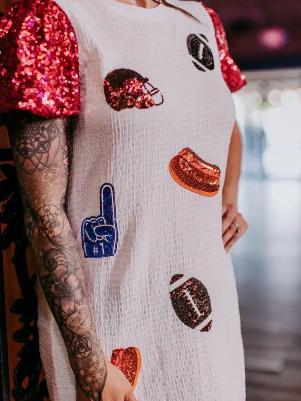White Mini Dress with Red Sequin Puff Sleeves and Sporty Embellishments